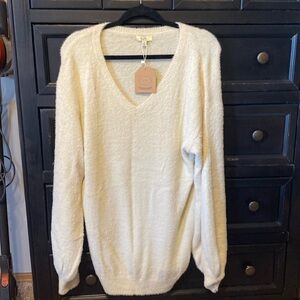 Long cream sweater